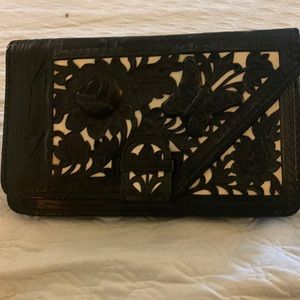 Vintage tooled leather clutch